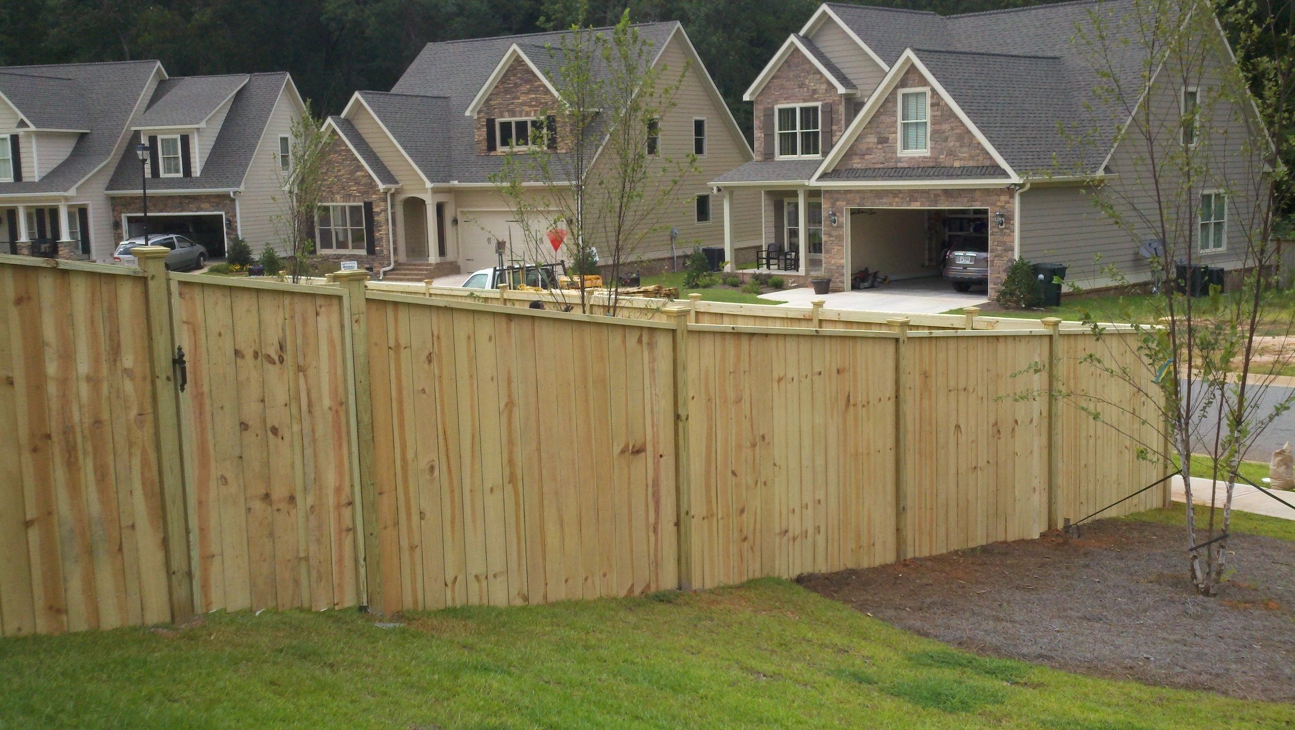 Wood privacy fence installed by AA Action Fence